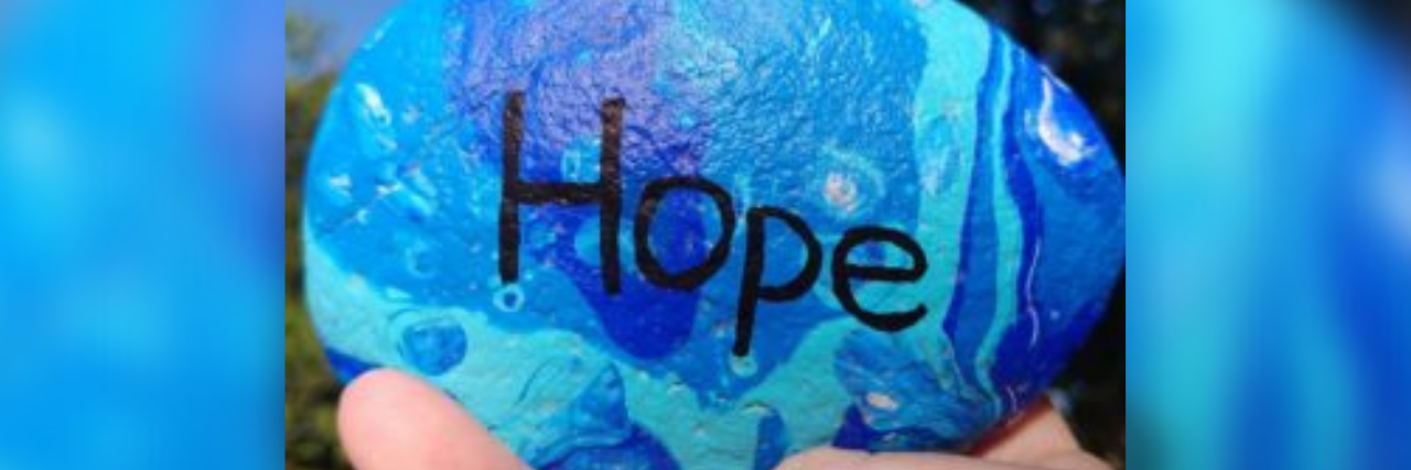 Saying 'I Won't Put in More Effort Than You Are' Harms Recovery A blue painted rock with the word "hope" written on it