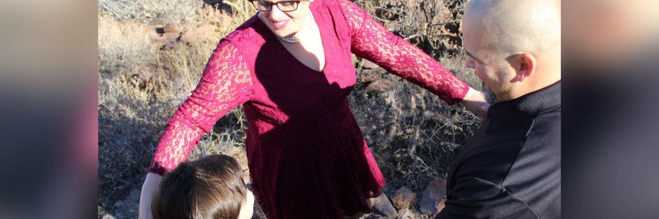 My Child Was Diagnosed With Autism Today -- and We Had a Party Family, parents and son holding hands.