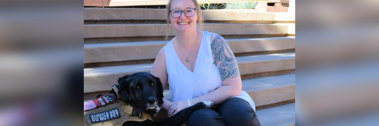 Parents, Please Teach Your Kids Not to Pet Service Dogs Laura sitting on steps with her service dog.