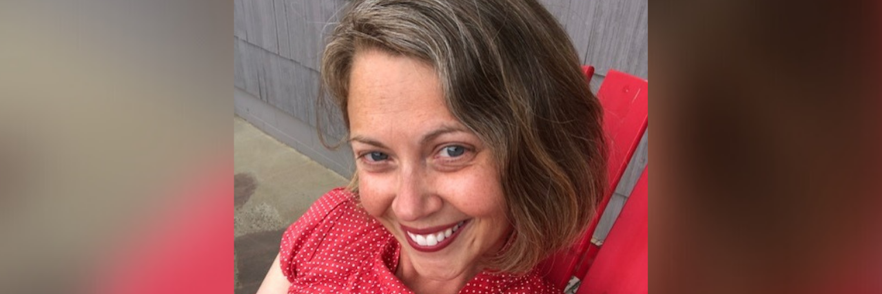 Photo of contributor wearing a red shirt and smiling