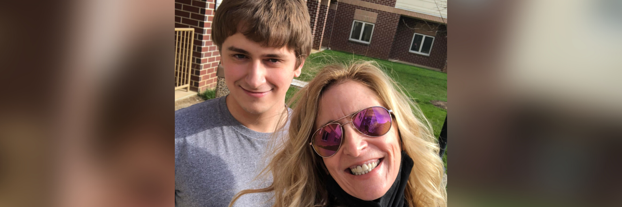 Autistics Shouldn't Have to Mask for the Neurotypical World Ryan and his mom Kathy smiling outdoors.