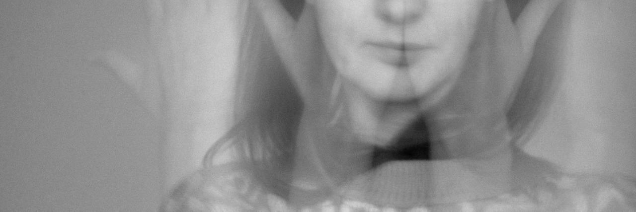 black and white distorted portrait of a woman