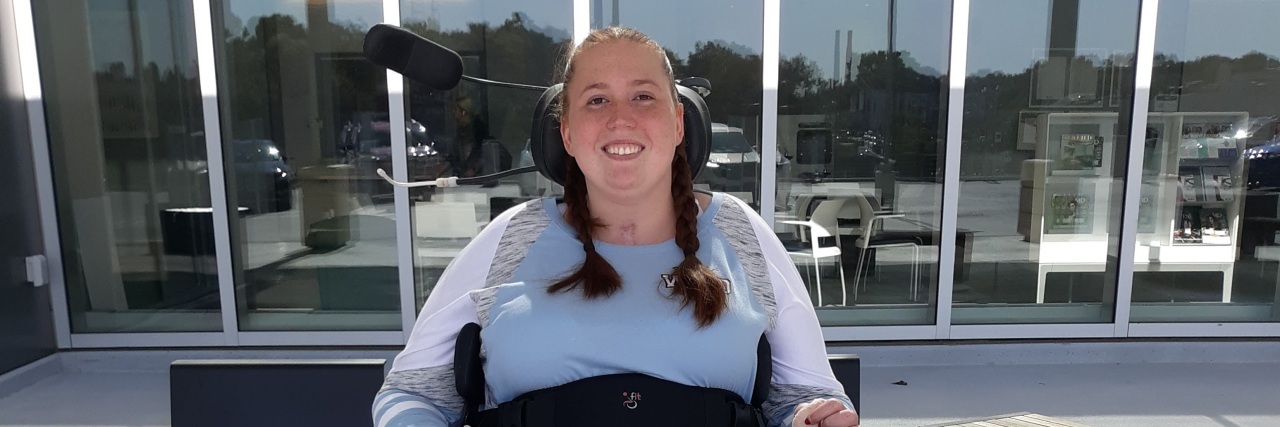 My Path to Independence After a Spinal Cord Injury Tiffany outside an office building in her power wheelchair.