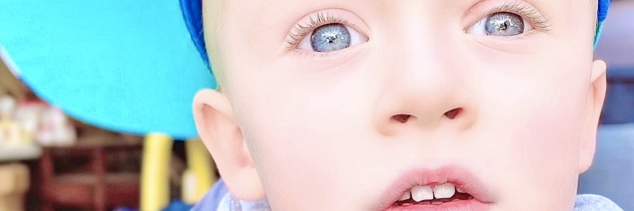 Please Stop Judging Parents for Having 'Only' One Child Jacqueline's son wearing a baseball cap.