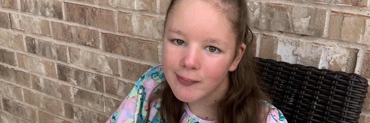 Sweet Sixteen for My Daughter With Intellectual Disabilities Marie sitting in a chair.