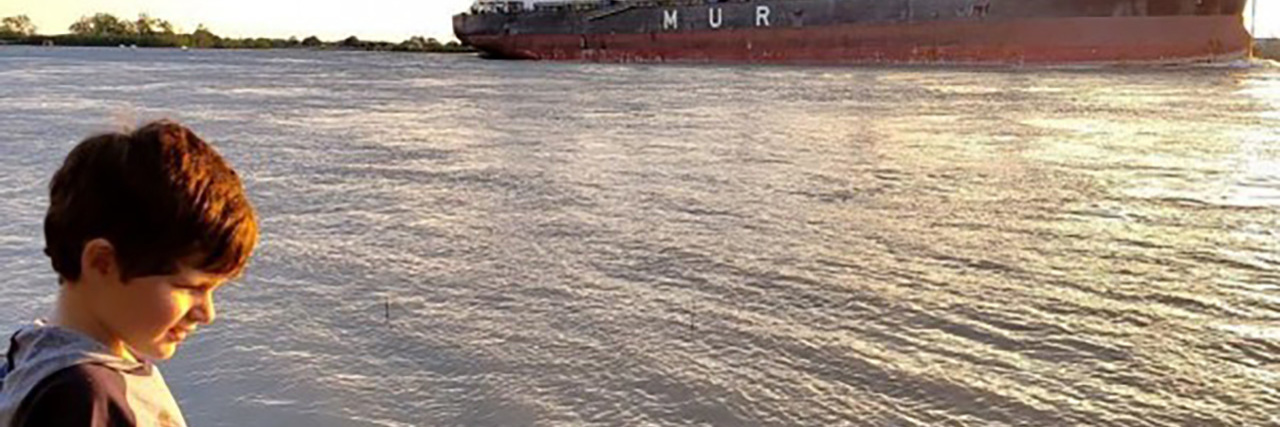 Why I Wanted to Erase My Son's Autism Label, but Now Embrace It Shannon's son looking at the water.