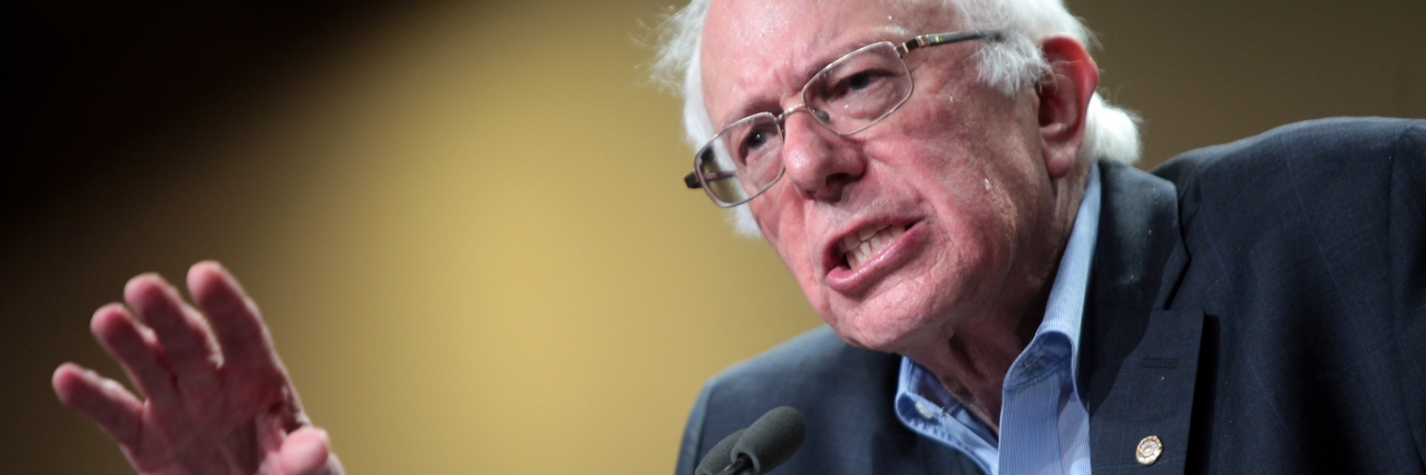 Bernie Sanders speaking at a podium.