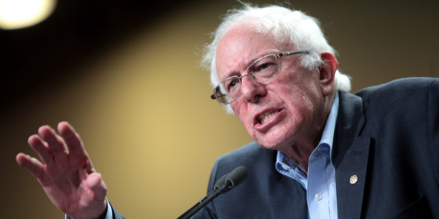 Before You Call Bernie Sanders a 'Diva,' Consider This Bernie Sanders speaking at a podium.