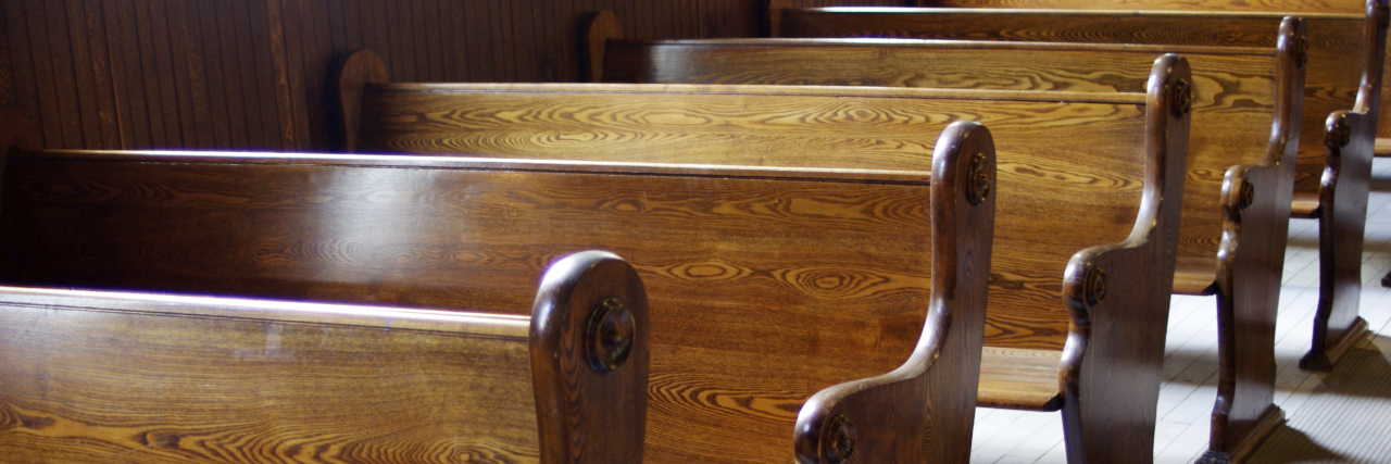 How Disability Stereotypes in Faith Communities Can Cause Harm Wooden church pews.