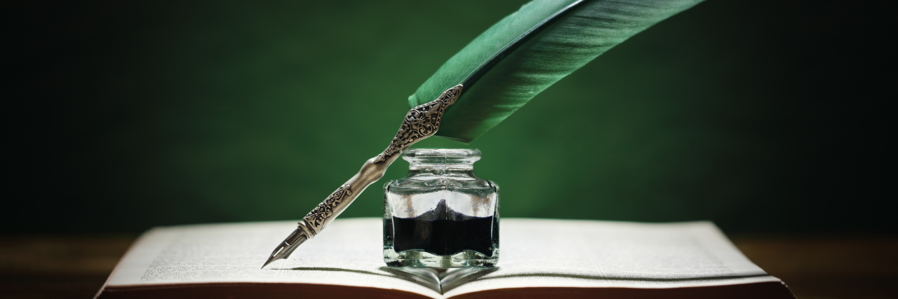 quill pen and an inkwell