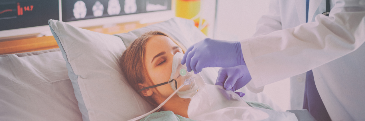 Woman on oxygen in hospital.