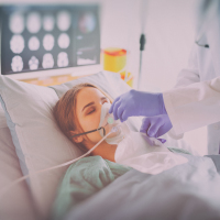 Woman on oxygen in hospital.