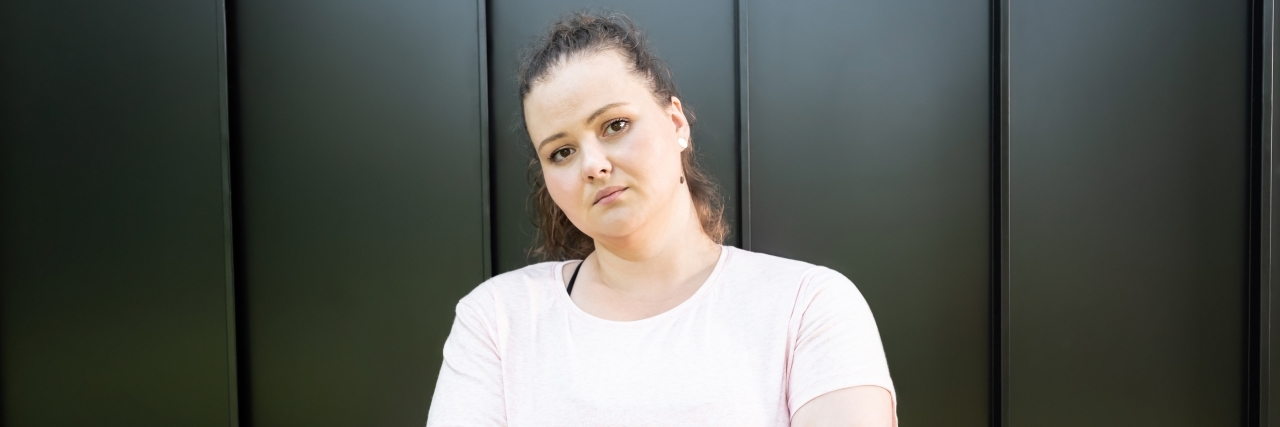 Why Weighing 'Certain' Passengers at the Airport is Harmful person upset looking at camera