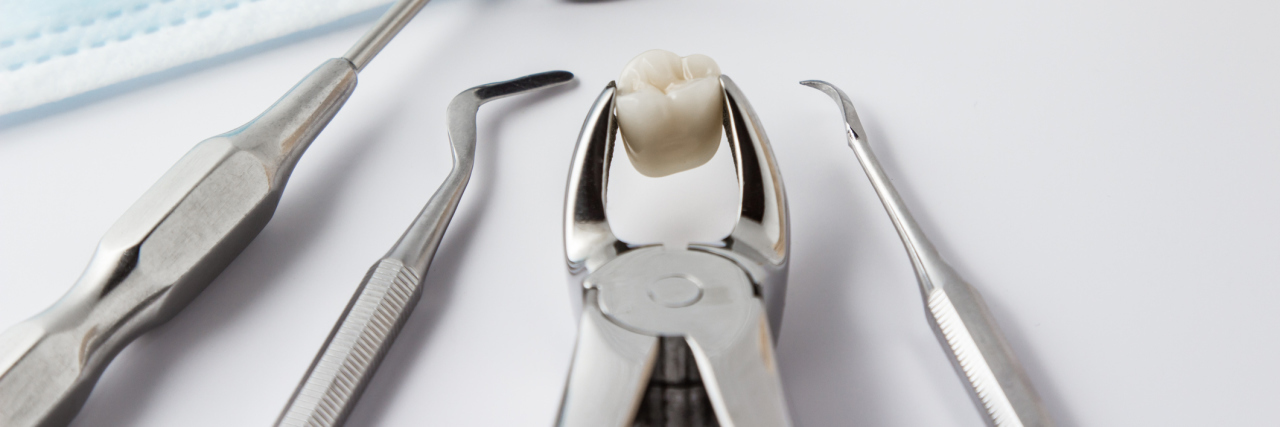 Getting My Wisdom Teeth Removed Taught Me to Face My Fears Stainless steel dental tools laying on a counter
