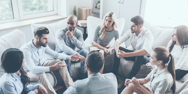 Diverse people at a support group.