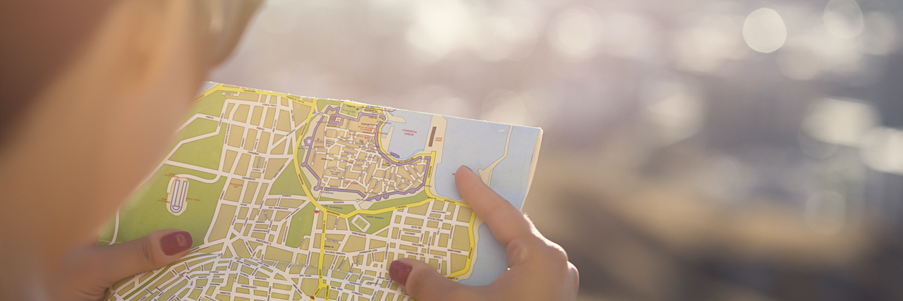 What I've Learned About Limitations With Chronic Illness Woman looking at map