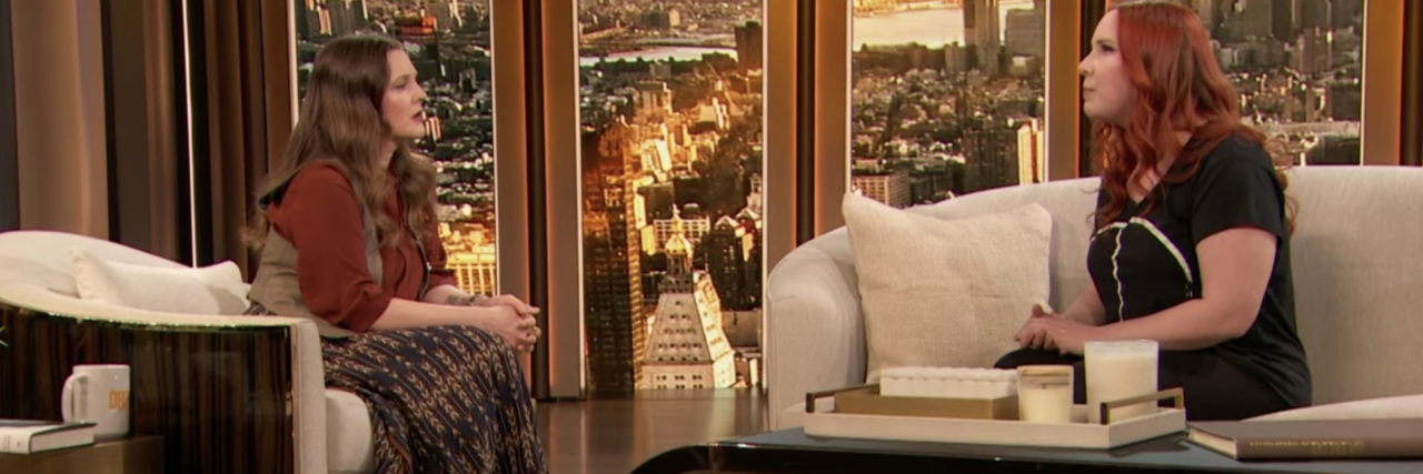 What Gaslighting Is and What It Isn't Drew Barrymore Sitting on couch with Dylan Farrow