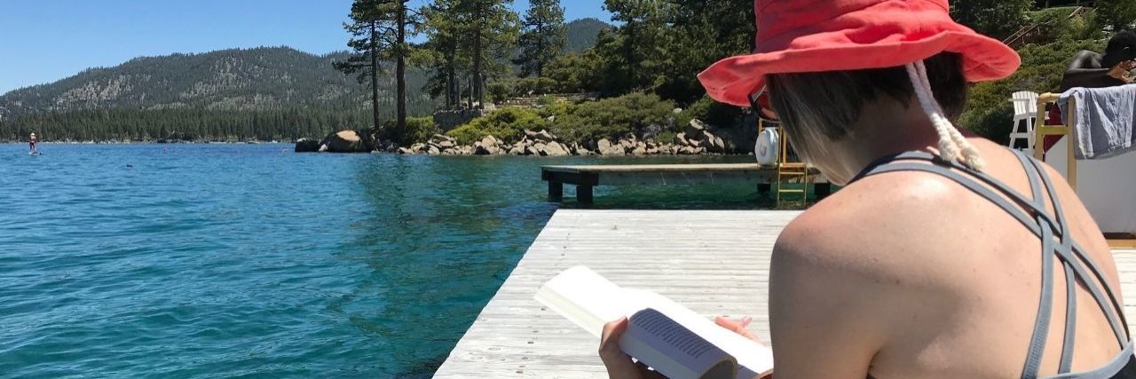 How I Found Peace When My Lungs Couldn't Be Fixed a woman sitting by a lake