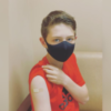 Boy who just received the COVID-19 vaccine.