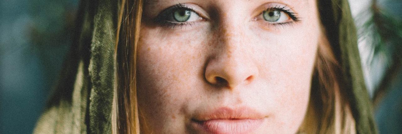 Daily Sexual Trauma Women Experience A woman looking straight ahead