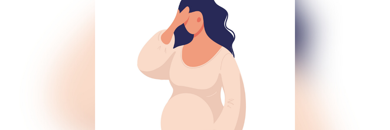 Pregnant woman embracing her stomach feeling distress