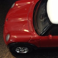 photo of a small red car toy which reads "Center for court innovation" on its roof