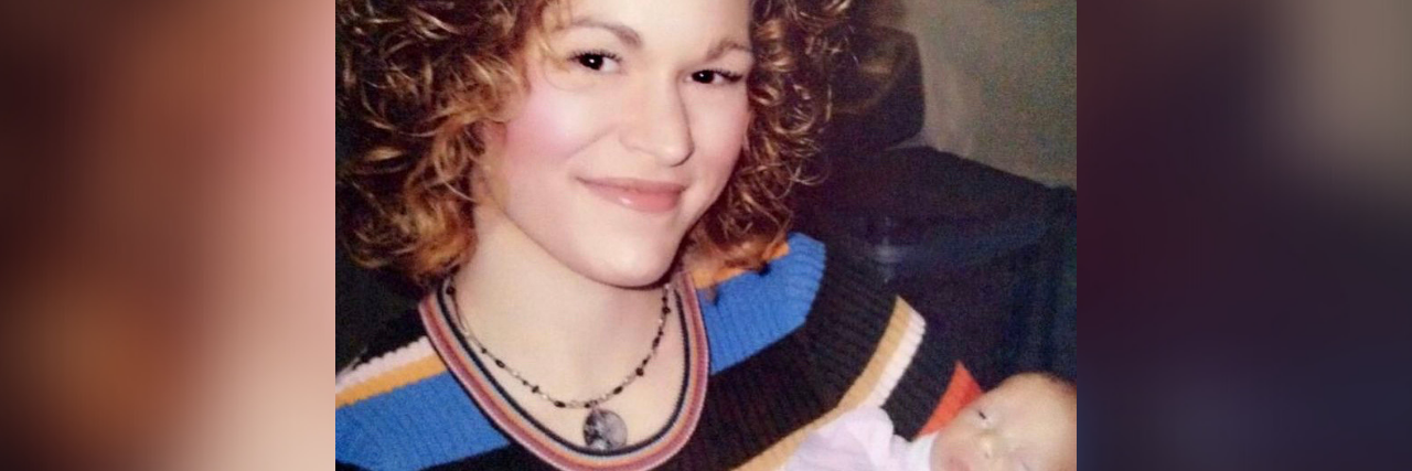 The Lifelong Grief of a Birth Mother in an Open Adoption Photo of contributor smiling and holding a baby