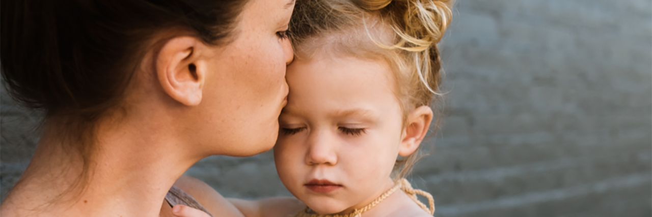 Your Child's Tummy Ache Could Be Abdominal Migraine Jennifer holding her daughter.