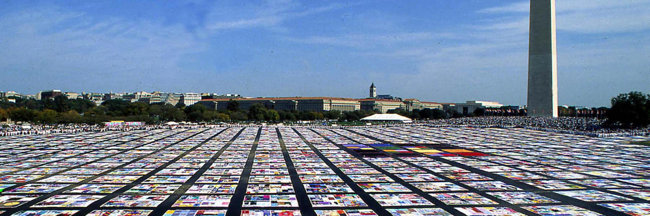 Living With Survivor's Guilt as a Long-Term HIV Survivor AIDS memorial quilt in Washington, DC.