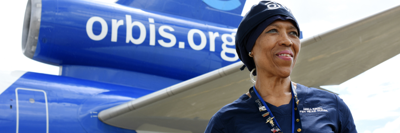 How Working for a Sight Saving Organization Changed My View a woman standing in front of the wing of an airplane