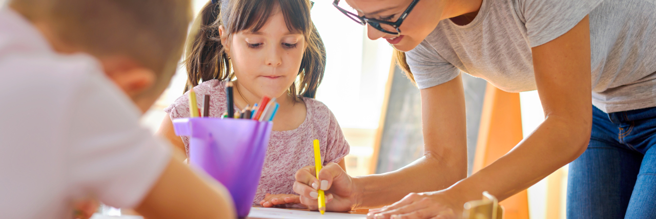 Becoming a Teacher to Help Kids With Learning Disabilities Like Me Teacher helping student.