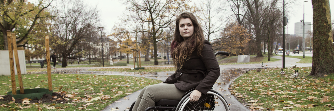 I Have Cerebral Palsy and I Deserve Acceptance Young woman in wheelchair outside.