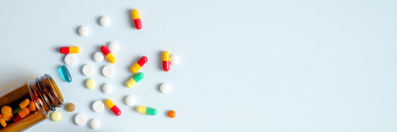 Why 'Pill Shaming' Isn't Always Obvious Pills spilling out of bottle.