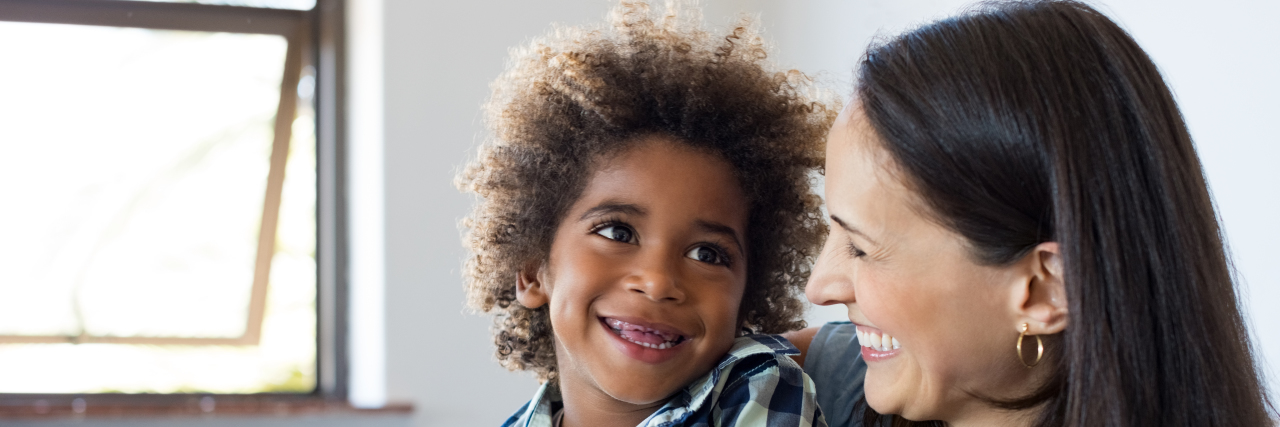 Uprooting My Own Ableism as I Parent My Autistic Son Mother and son laughing.