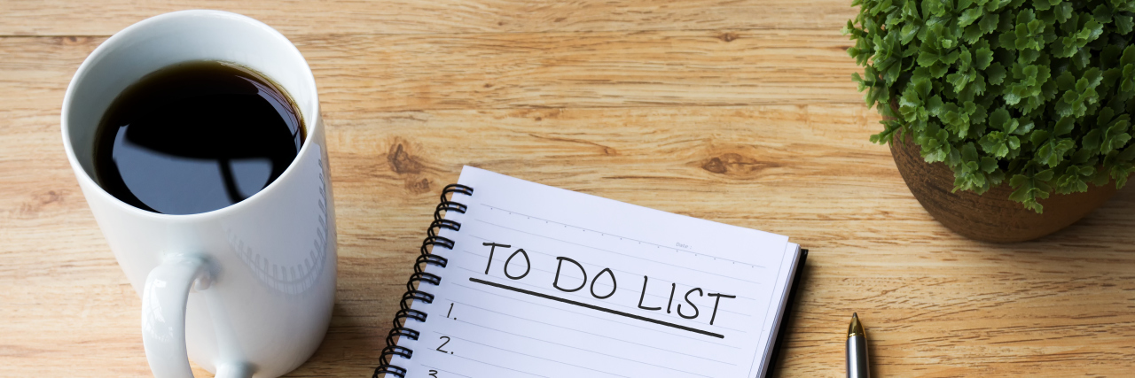 Small Actions Can Make a Big Difference in Life With Chronic Pain To do list on notepad with coffee and pen on office desk.