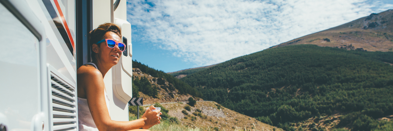 Living Fully, Yet Within My Limits, With Chronic Illness Woman sitting on RV step.