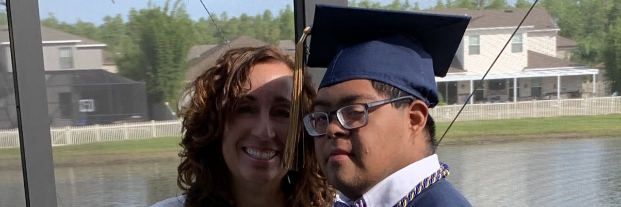Celebrating as My Son With Down Syndrome Graduates From High School Raymond and Mom at graduation.
