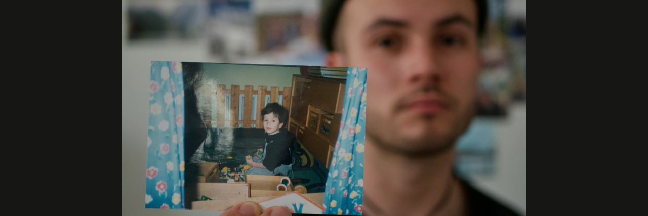 3 Things I Had to Believe to Recover From Childhood Sexual Abuse Author: a young, white man wearing a beanie, holding a picture of himself as a child