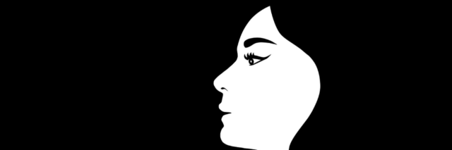 Side profile of a silhouette of a woman looking ahead thoughtfully, not smiling