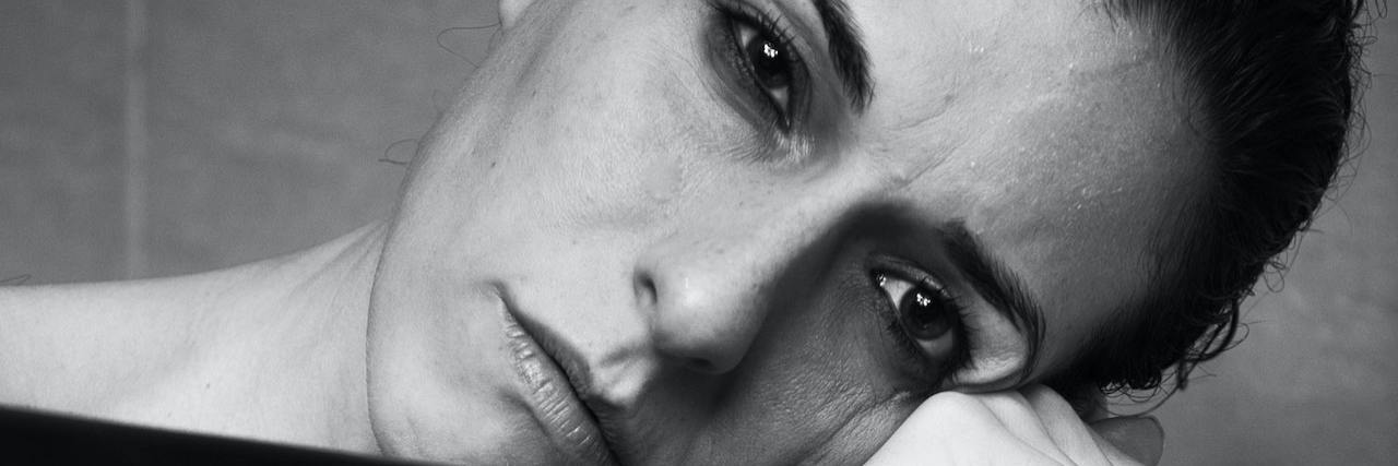 We Need to Take the Trauma of Sexual Coercion More Seriously A woman sitting with her head against the back of a chair