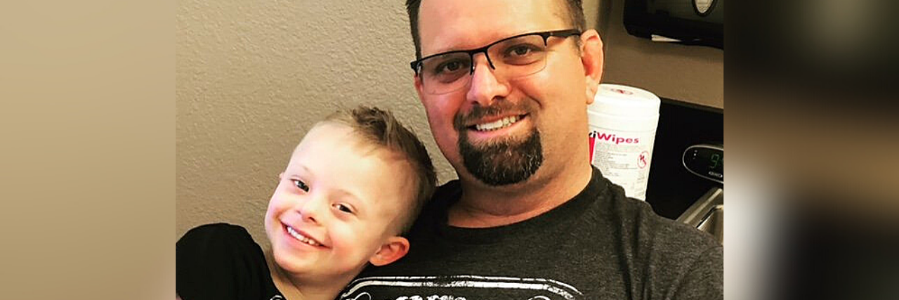 Everyday Inclusion Matters as the Parent of a Child With Down Syndrome Bo and son hugging.