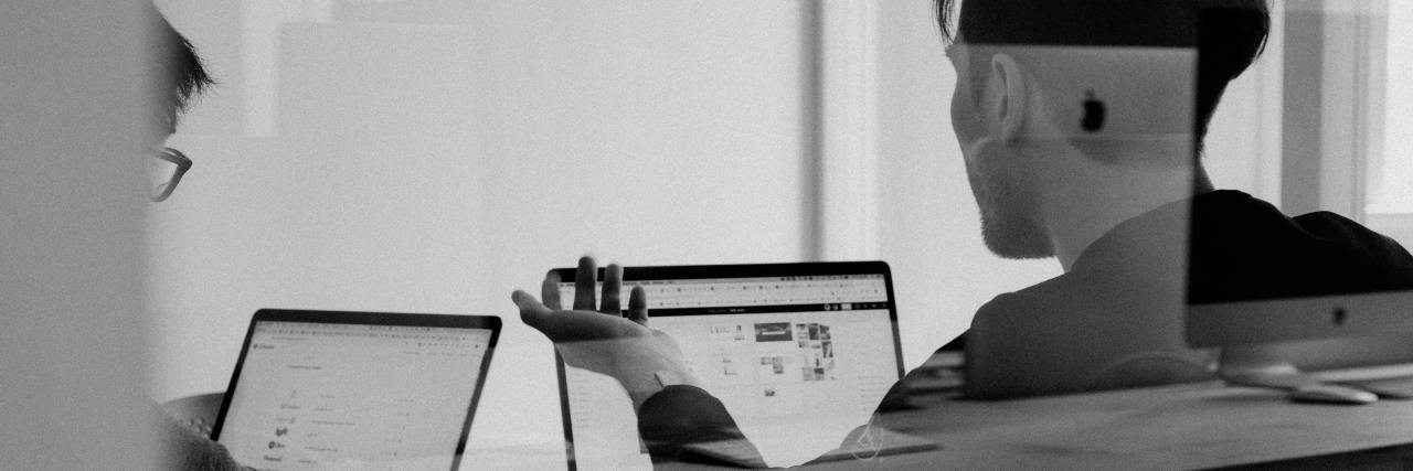 My Morning Experience With Borderline Personality Disorder black and white photo of two people talking in a meeting with laptops