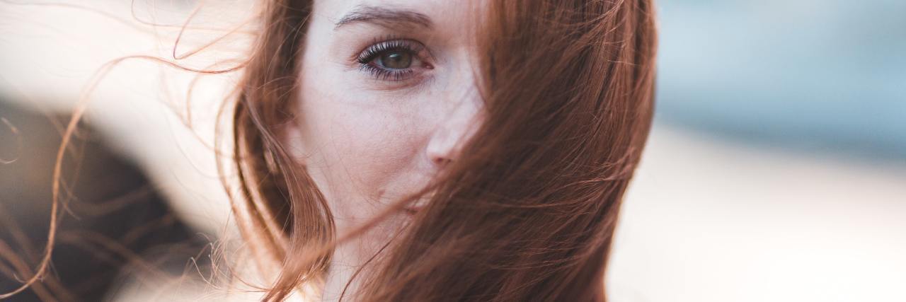 What to Know If You Are Struggling With Your Type of Therapy photo of a woman with red hair looking into the camera