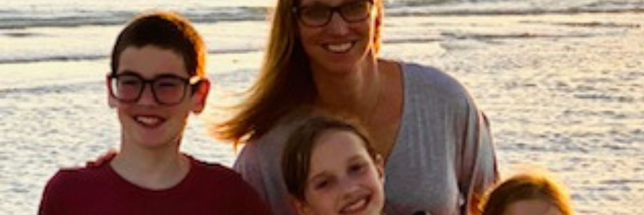 Lindsay with her family at the beach.