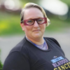 Photo of contributor wearing glasses and tshirt that says "I am a bladder cancer survivor"
