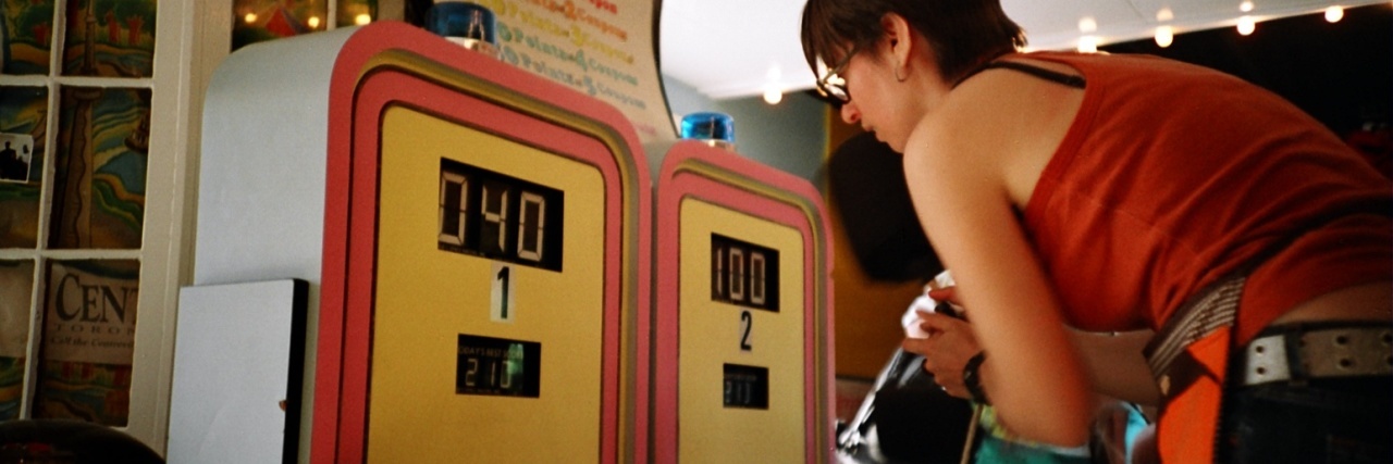 Experiencing New Eating Disorder Behaviors When You're in Recovery photo of a woman playing whac-a-mole