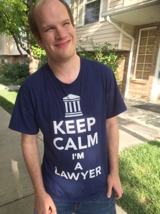Michael standing outdoors wearing a shirt that says "Keep calm, I'm a lawyer."