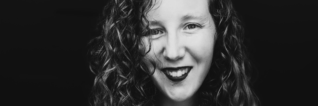 What Disability Pride Means as Someone With Invisible Disabilities Black and white photo of Amelia.