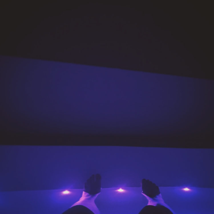 photo of the contributor's floatation tank experience with coloured purple lights