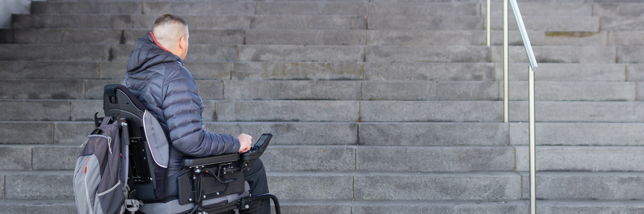 Why the New York Times' Coverage of ADA Lawsuits Is Harmful Man in power wheelchair looking at a flight of stairs.